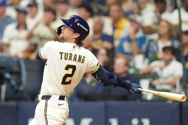 MILWAUKEE, WISCONSIN - OCTOBER 11: Brice Turang #2 of the Milwaukee Brewers hits a home run against the Los Angeles Dodgers during the fourth inning in game one of the National League Championship Series at American Family Field on October 11, 2026 in Milwaukee, Wisconsin. (Photo by John Fisher/Getty Images)