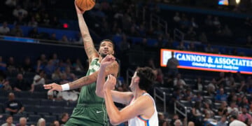 Milwaukee Bucks center Kel'el Ware, left, shoots over Oklahoma City Thunder center Aday Mara during the second half of an NBA basketball game, Wednesday, Oct. 7, 2026, in Oklahoma City. (AP Photo/Kyle Phillips)