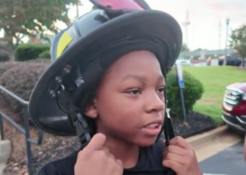 boy in firemans hat