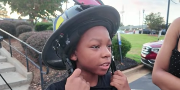 boy in firemans hat