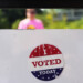 FILE - An, " I Voted Today," sticker is stuck to an information sign at Olbrich Gardens, Aug. 11, 2026, in Madison, Wis. (AP Photo/Nam Y. Huh, File)