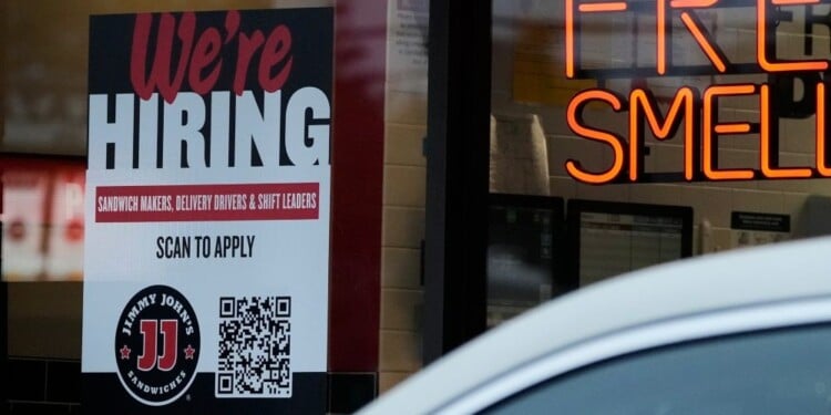 A hiring sign is displayed at a sandwich shop, in Streamwood, Ill., Wednesday, Sept. 16, 2026. (AP Photo/Nam Y. Huh)