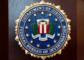 An FBI seal is displayed on a podium before a news conference at the field office in Portland, Ore., Jan. 16, 2025. (AP Photo/Jenny Kane, File)