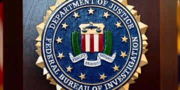 An FBI seal is displayed on a podium before a news conference at the field office in Portland, Ore., Jan. 16, 2025. (AP Photo/Jenny Kane, File)