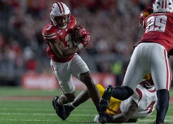 Abu Sama III carries the football at Camp Randall against USC.