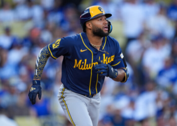 Milwaukee Brewers left fielder Jackson Chourio watches his solo home run take flight during the first inning of Game 3 of baseball's National League Championship Series between the Milwaukee Brewers and the Los Angeles Dodgers, Wednesday, Oct. 14, 2026, in Los Angeles. (AP Photo/Gregory Bull)