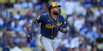 Milwaukee Brewers left fielder Jackson Chourio watches his solo home run take flight during the first inning of Game 3 of baseball's National League Championship Series between the Milwaukee Brewers and the Los Angeles Dodgers, Wednesday, Oct. 14, 2026, in Los Angeles. (AP Photo/Gregory Bull)