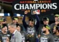 The Milwaukee Brewers celebrate after Game 4 of baseball's National League Championship Series between the Milwaukee Brewers and the Los Angeles Dodgers, Thursday, Oct. 15, 2026, in Los Angeles. (AP Photo/Ashley Landis)