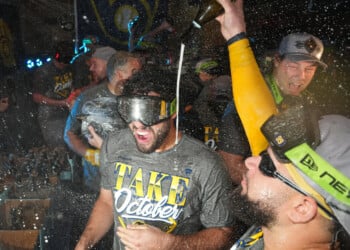 Milwaukee Brewers players celebrate after the team defeated the San Diego Padres in Game 4 of baseball's National League Division Series Wednesday, Oct. 7, 2026, in San Diego, to advance to the National League Championship Series. (AP Photo/Gregory Bull)