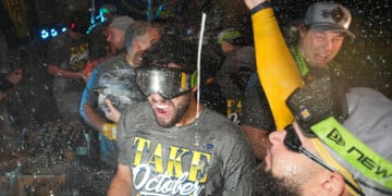 Milwaukee Brewers players celebrate after the team defeated the San Diego Padres in Game 4 of baseball's National League Division Series Wednesday, Oct. 7, 2026, in San Diego, to advance to the National League Championship Series. (AP Photo/Gregory Bull)