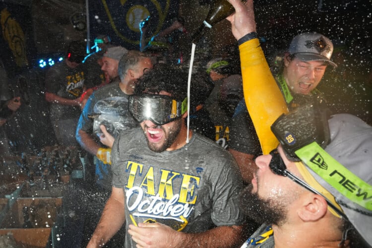 Milwaukee Brewers players celebrate after the team defeated the San Diego Padres in Game 4 of baseball's National League Division Series Wednesday, Oct. 7, 2026, in San Diego, to advance to the National League Championship Series. (AP Photo/Gregory Bull)