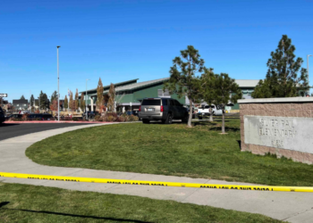 Police tape is placed outside Silver Rail Elementary school, where a shooting took place, on Thursday, Oct. 15, 2026 in Bend, Ore. (AP Photo/Joe Kline)