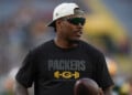 FILE - Green Bay Packers running back Josh Jacobs stands on the field before a preseason NFL football game against the Arizona Cardinals, Aug. 28, 2026, in Green Bay, Wis. (AP Photo/Abbie Parr, File)