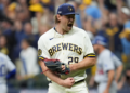 Milwaukee Brewers pitcher Trevor Megill celebrates after Game 1 of baseball's National League Championship Series between the Milwaukee Brewers and the Los Angeles Dodgers, Sunday, Oct. 11, 2026, in Milwaukee. (AP Photo/Abbie Parr)