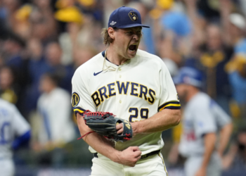 Milwaukee Brewers pitcher Trevor Megill celebrates after Game 1 of baseball's National League Championship Series between the Milwaukee Brewers and the Los Angeles Dodgers, Sunday, Oct. 11, 2026, in Milwaukee. (AP Photo/Abbie Parr)