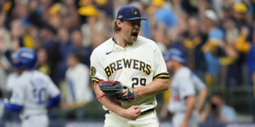 Milwaukee Brewers pitcher Trevor Megill celebrates after Game 1 of baseball's National League Championship Series between the Milwaukee Brewers and the Los Angeles Dodgers, Sunday, Oct. 11, 2026, in Milwaukee. (AP Photo/Abbie Parr)