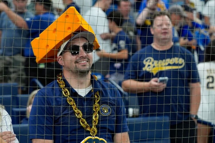 A Milwaukee Brewers fan watches warm ups prior to Game 4 of baseball's World Series, Tuesday, Oct. 27, 2026, in St. Petersburg, Fla., between the Milwaukee Brewers and the Tampa Bay Rays. (AP Photo/Chris O'Meara)