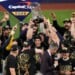 Milwaukee Brewers designated hitter Christian Yelich holds the World Series trophy with teammates after winning baseball's World Series, against the Tampa Bay Rays, Wednesday, Oct. 28, 2026, in St. Petersburg, Fla. (AP Photo/Morry Gash)